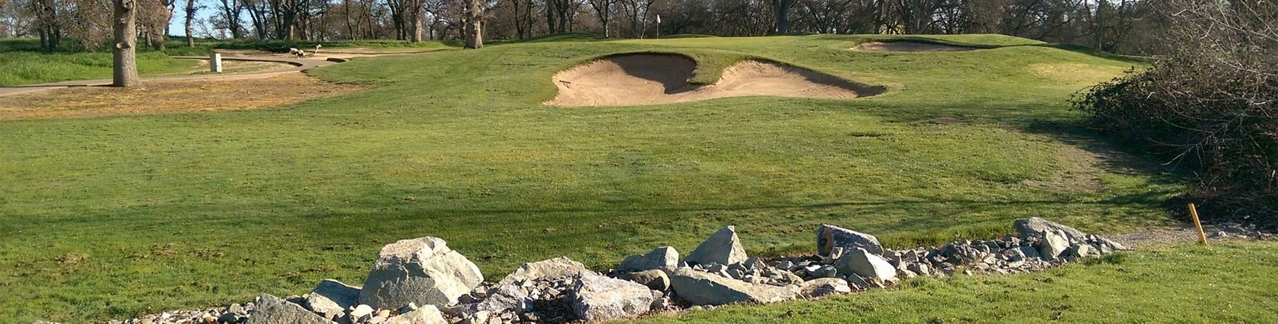 Greenside bunkering and rock-lined fairway at a City of Roseville golf course