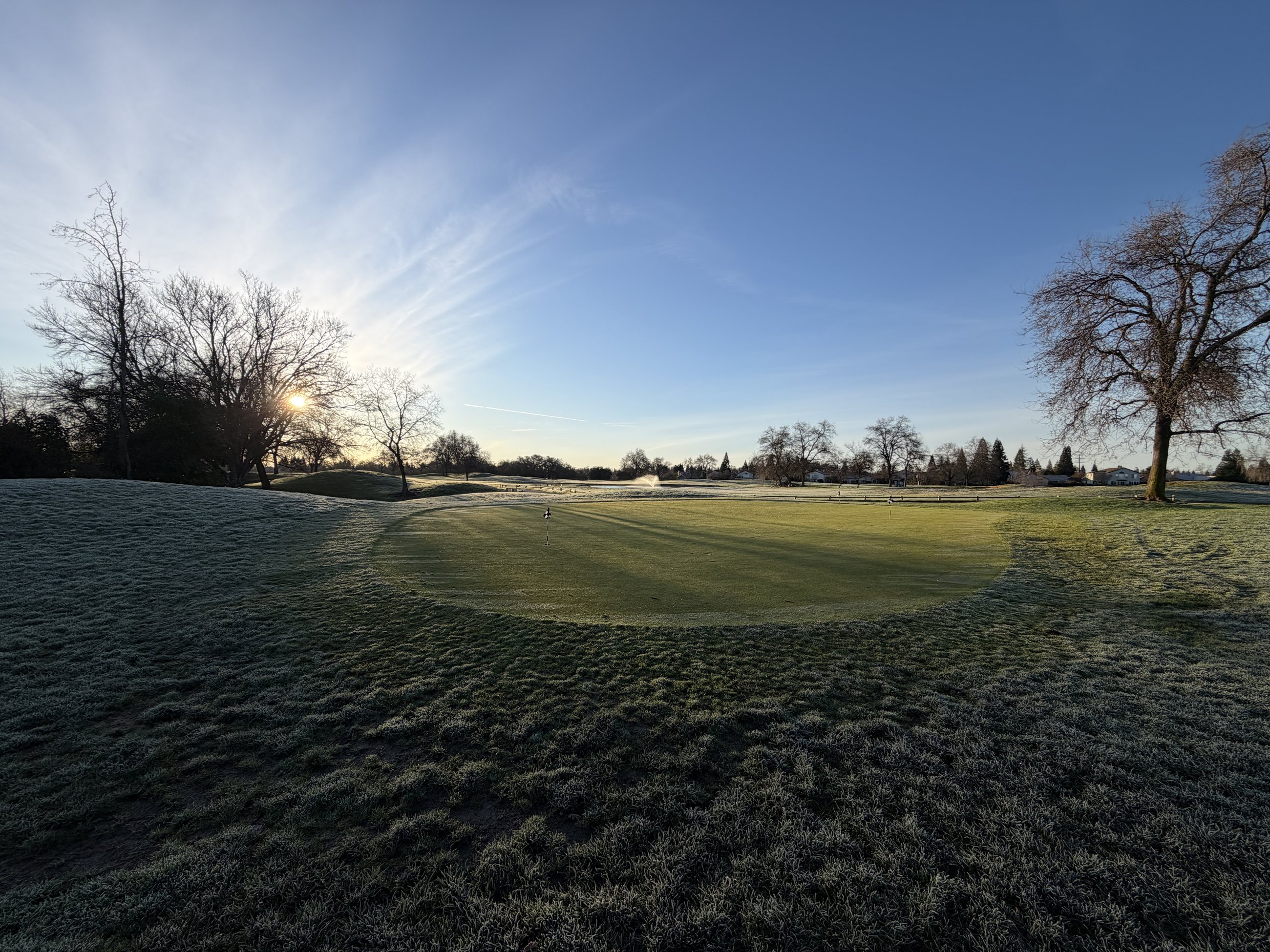 First light over a frosted green at Woodcreek Golf Club