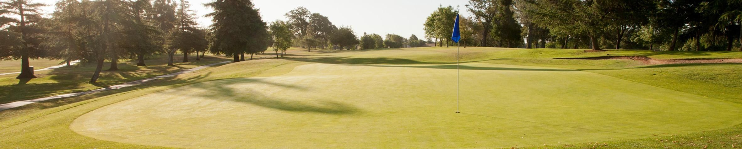 A wide fairway and greenside bunkering set up for a tournament round