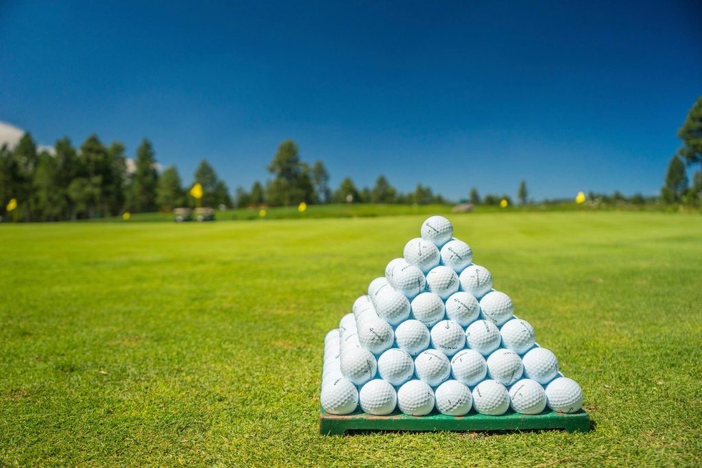 A pyramid of practice balls waiting on the range