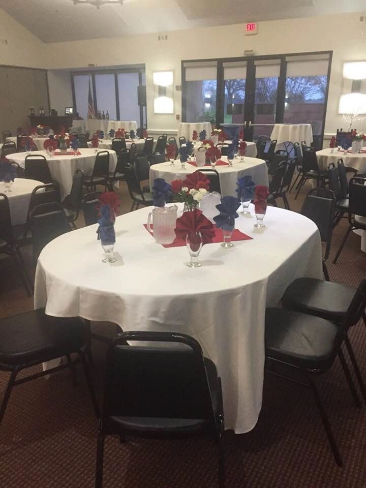 Banquet room in daylight with floor to ceiling windows onto the course